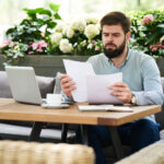 businessman comparing documents for certified translations